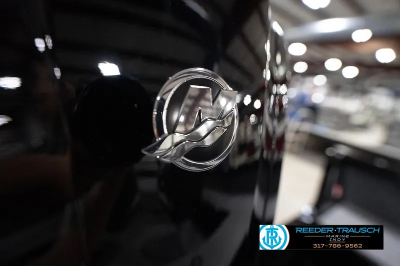 Slide: The Image of Close-up of 2026 Lund 1800 Explorer Sport logo in a showroom setting. - 106