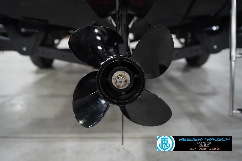 Slide: The Image of Propeller of 2026 Lund 1800 Explorer Sport boat in showroom setting. - 107