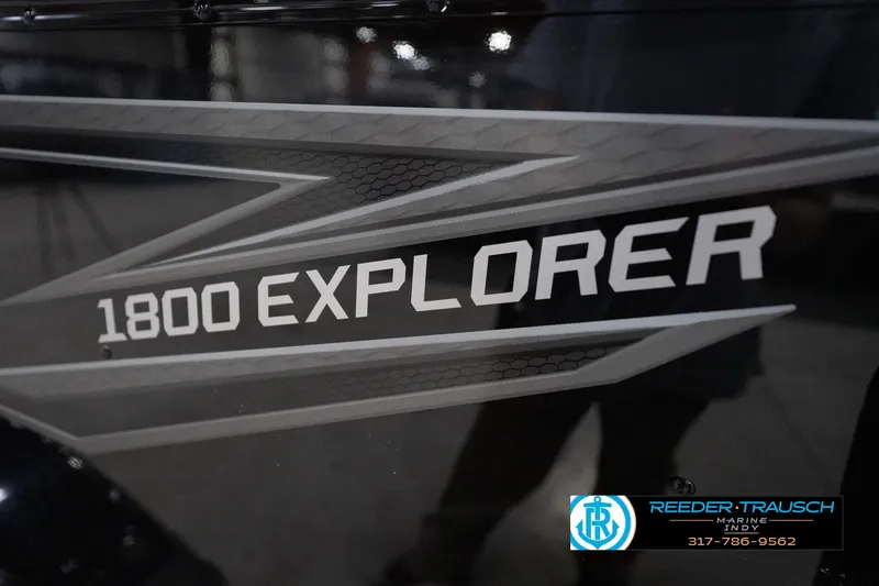 Slide: The Image of 2026 Lund 1800 Explorer Sport boat logo with Reeder-Trausch Marine contact details. - 109
