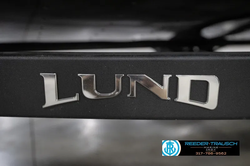 Slide: The Image of Close-up of Lund logo on 2026 Lund 1800 Explorer Sport boat. - 112
