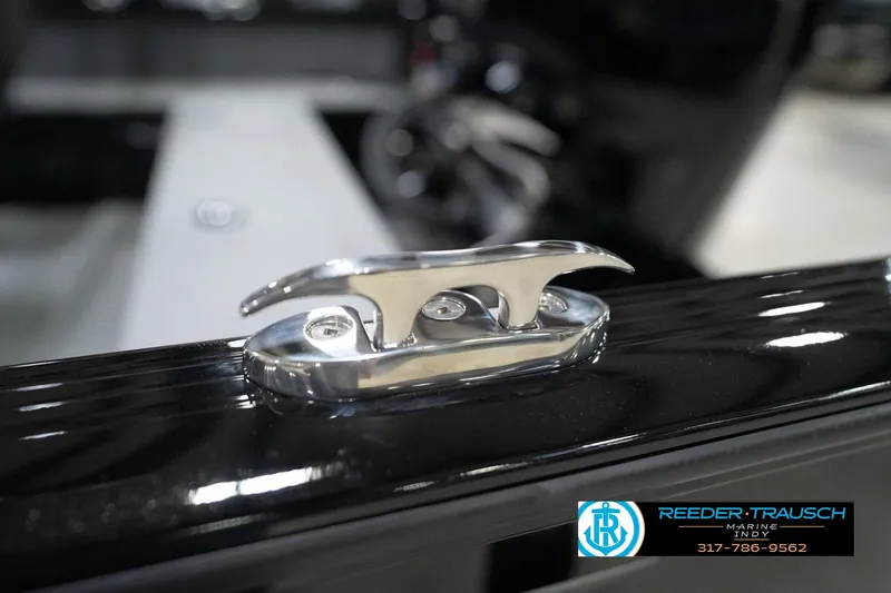 Slide: The Image of 2026 Lund 1800 Explorer Sport boat cleat detail, shiny metal finish. - 116