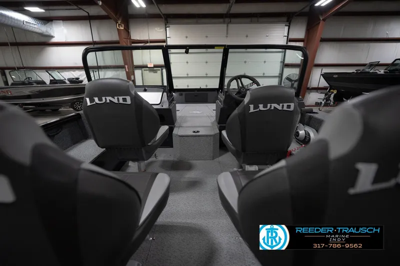 Slide: The Image of 2026 Lund 1800 Explorer Sport boat interior with four seats and steering console. - 16