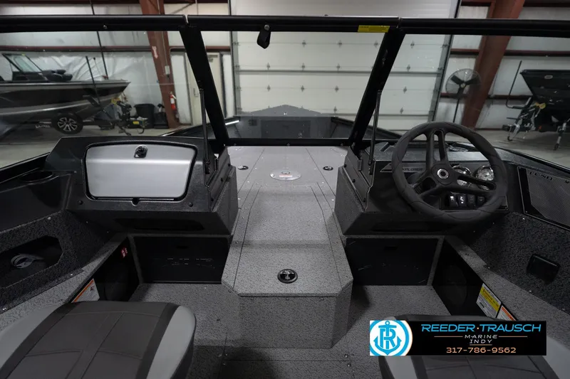 Slide: The Image of 2026 Lund 1800 Explorer Sport boat interior with four seats and steering console. - 17