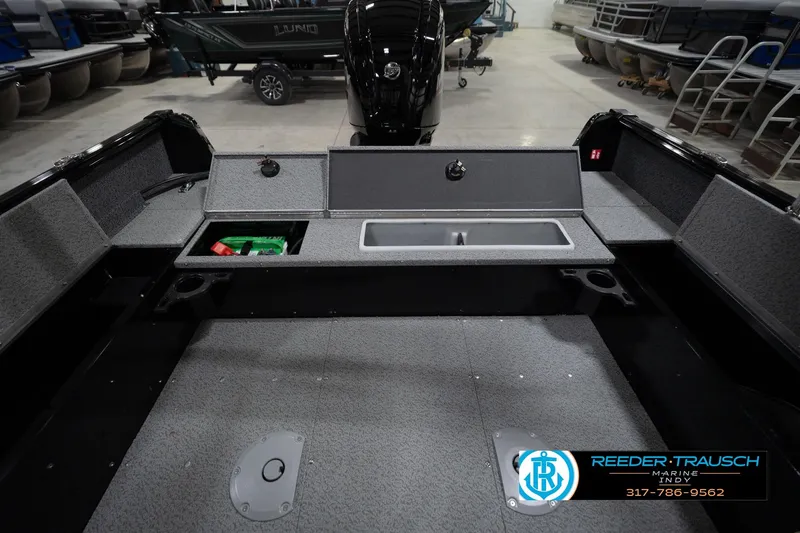 Slide: The Image of 2026 Lund 1800 Explorer Sport boat interior with four seats in showroom. - 24