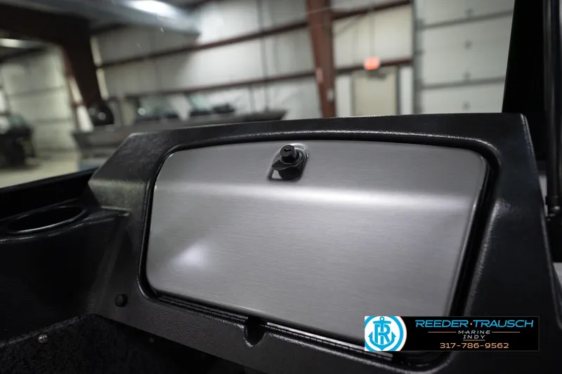 Slide: The Image of 2026 Lund 1800 Explorer Sport boat seats in showroom, featuring sleek gray design. - 25