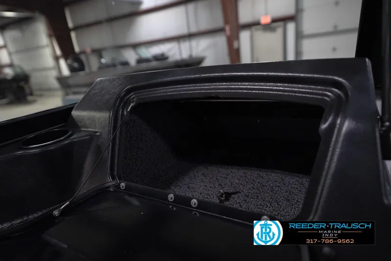 Slide: The Image of 2026 Lund 1800 Explorer Sport boat interior with branded seats in a showroom. - 26