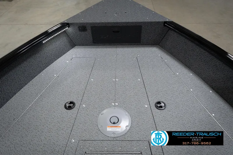 Slide: The Image of 2026 Lund 1800 Explorer Sport boat interior with storage compartments and sink. - 29