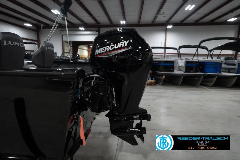 Slide: The Image of 2026 Lund 1800 Explorer Sport boat interior with comfortable seating and control panel. - 45