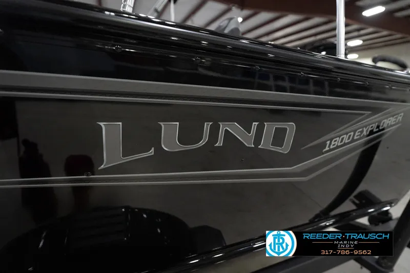 Slide: The Image of 2026 Lund 1800 Explorer Sport boat interior with textured flooring, Reeder-Trausch Marine logo. - 50