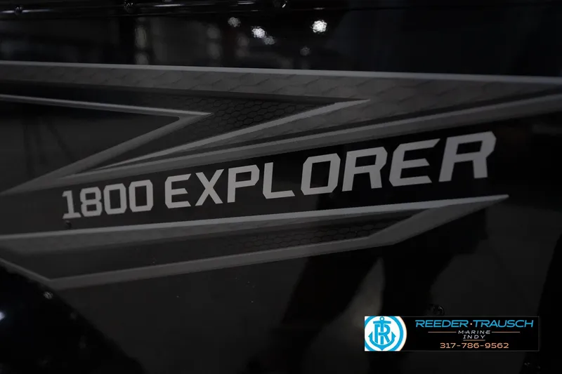 Slide: The Image of 2026 Lund 1800 Explorer Sport with Mercury outboard motor in showroom. - 51