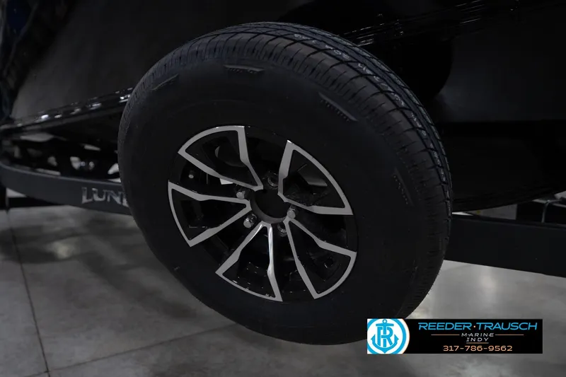 Slide: The Image of Propeller of 2026 Lund 1800 Explorer Sport boat in showroom setting. - 55