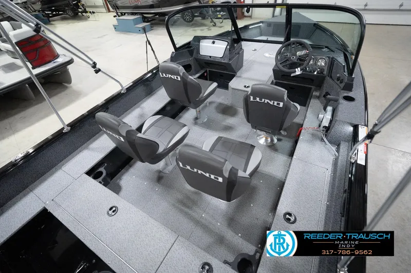 Slide: The Image of 2026 Lund 1800 Explorer Sport boat interior with four seats and steering console. - 72