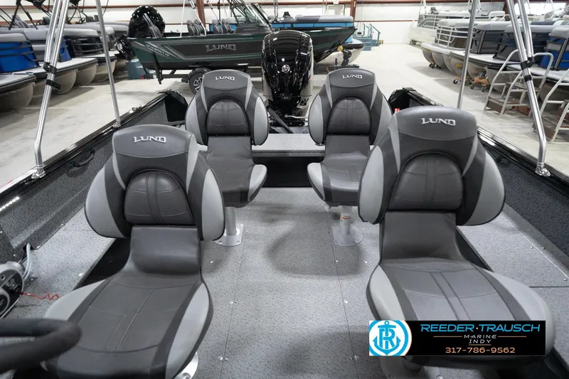 Slide: The Image of 2026 Lund 1800 Explorer Sport boat interior with four seats in showroom. - 78