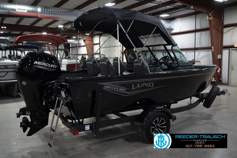 Slide: The Image of 2026 Lund 1800 Explorer Sport boat with Mercury engine in showroom. - 8