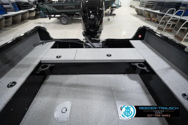 Slide: The Image of 2026 Lund 1800 Explorer Sport boat interior with motor, showcased at Reeder-Trausch Marine. - 81