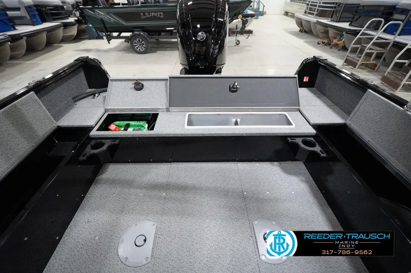 Slide: The Image of 2026 Lund 1800 Explorer Sport boat interior with storage compartments and sink. - 82