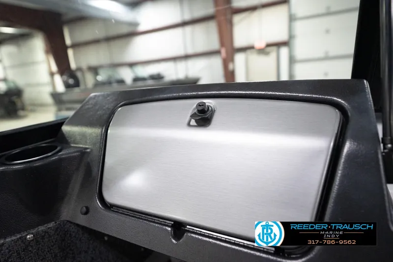 Slide: The Image of Interior view of 2026 Lund 1800 Explorer Sport boat dashboard in a showroom. - 83