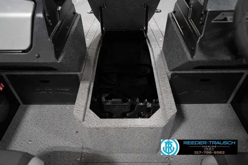 Slide: The Image of 2026 Lund 1800 Explorer Sport boat interior storage compartment, gray finish, Reeder-Trausch Marine logo. - 86