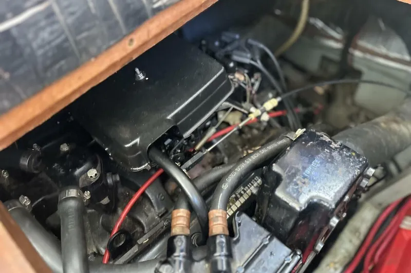 Slide: The Image of Engine compartment of a 1985 Carver 3207 Aft Cabin boat, showing wiring and components. - 27