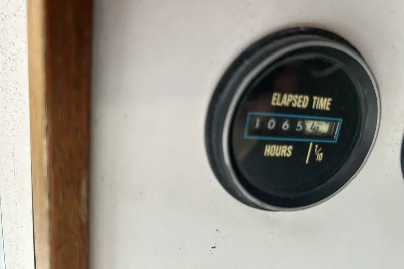 Slide: The Image of Elapsed time gauge on 1985 Carver 3207 Aft Cabin, showing 1065.4 hours. - 29
