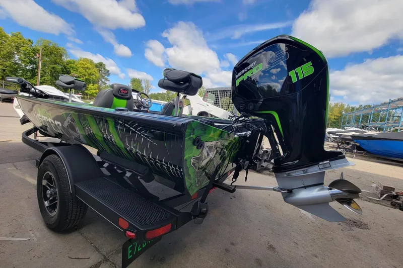 Slide: The Image of 2023 Ranger RT188 boat with Mercury Pro XS 115 engine, vibrant green and black design. - 2