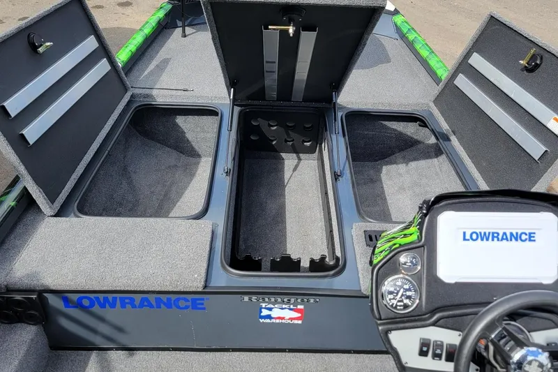Slide: The Image of 2023 Ranger RT188 boat interior with storage compartments and Lowrance electronics. - 5