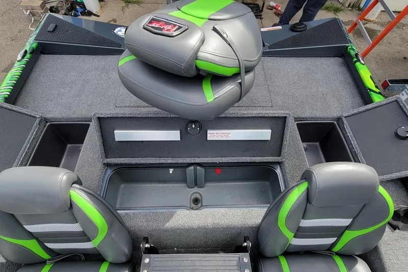 Slide: The Image of 2023 Ranger RT188 boat interior with green and gray seating and storage compartments. - 8