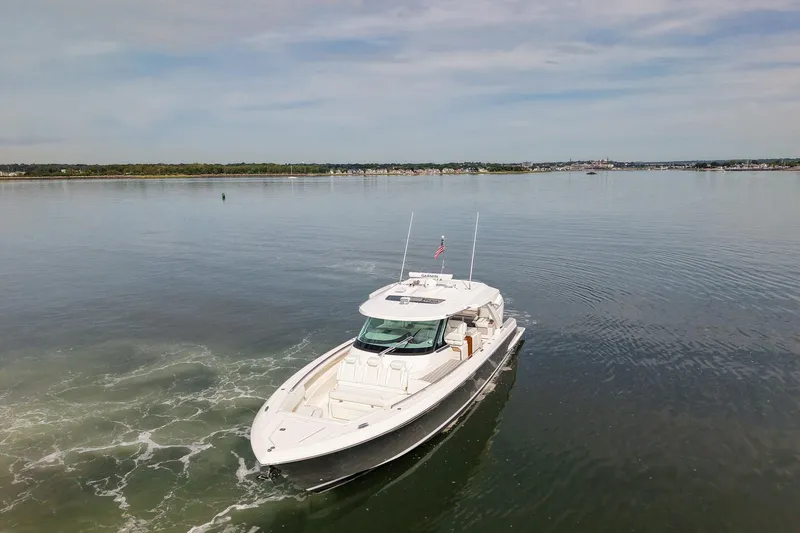 Slide: The Image of 2025 Tiara Yachts 43 LS cruising on calm waters under a clear sky. - 3
