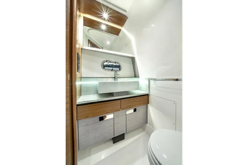 Slide: The Image of Manufacturer Provided Image: Luxurious bathroom interior of 2025 Tiara Yachts 43 LS, featuring modern sink and elegant design. - 43