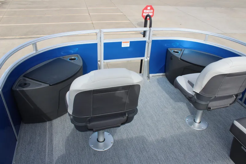 Slide: The Image of 2026 Sun Tracker Fishin' Barge 20 DLX interior with seating and storage compartments. - 12