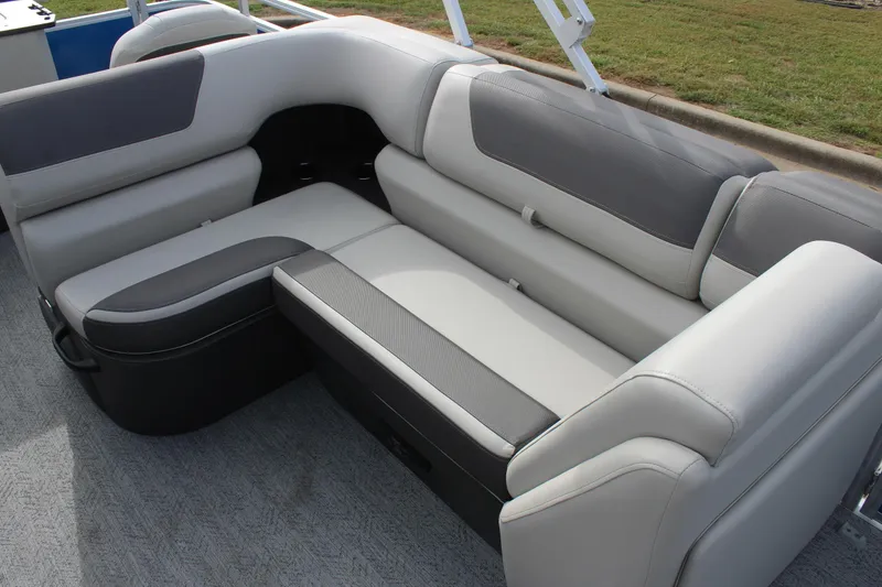 Slide: The Image of 2026 Sun Tracker Fishin' Barge 20 DLX, featuring comfortable gray seating on deck. - 13