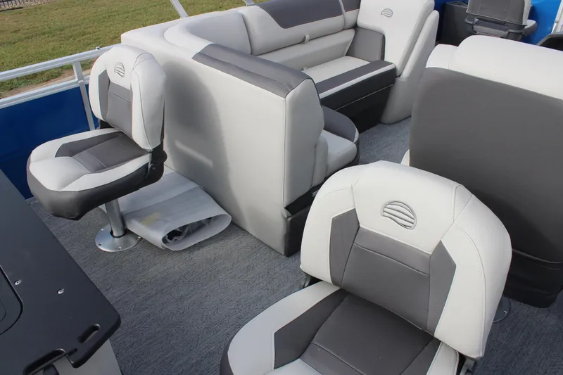 Slide: The Image of 2026 Sun Tracker Fishin' Barge 20 DLX interior with comfortable seating and modern design. - 16