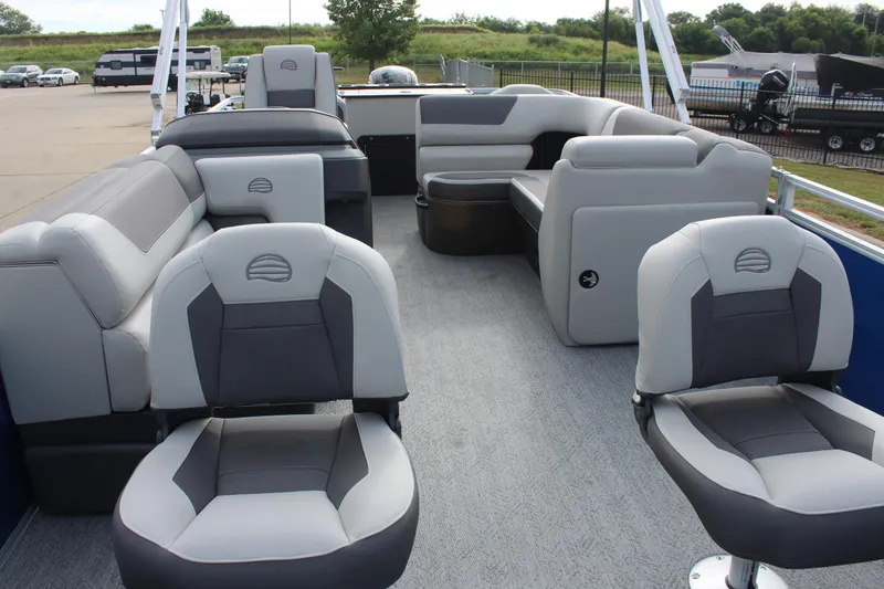 Slide: The Image of 2026 Sun Tracker Fishin' Barge 20 DLX interior with gray seating and spacious layout. - 9