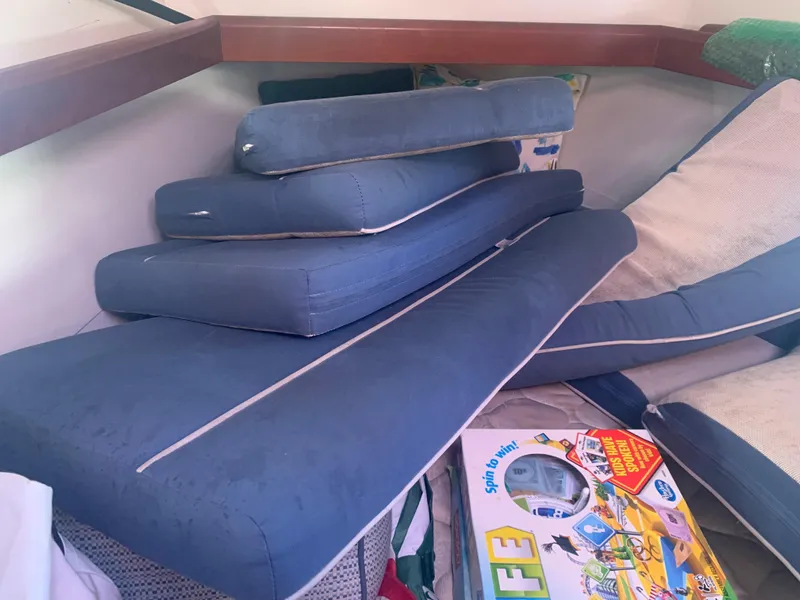 Slide: The Image of Cushions stacked inside a 2010 Beneteau Oceanis 43 sailboat cabin. - 21