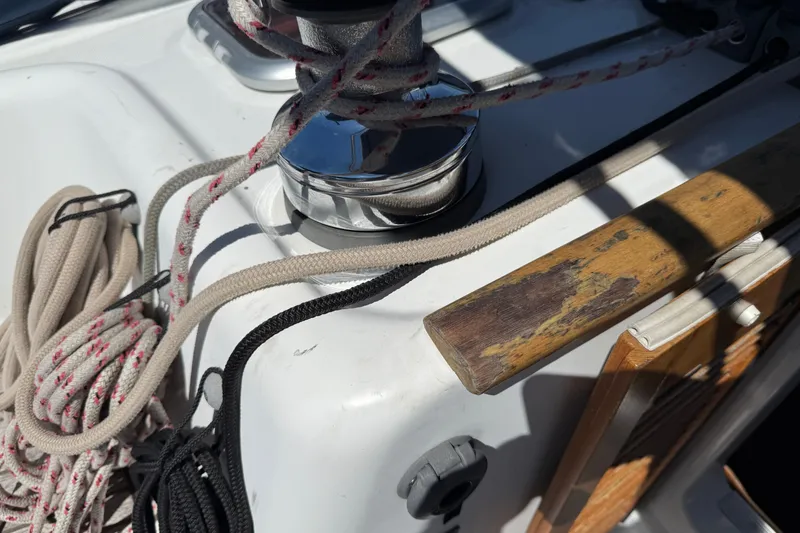 Slide: The Image of Close-up of Beneteau Oceanis 43 sailboat deck with ropes and winch, 2010 model. - 24