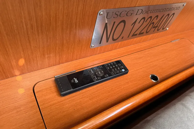 Slide: The Image of USCG documentation plaque and JVC remote on Beneteau Oceanis 43 yacht, 2010 model. - 32
