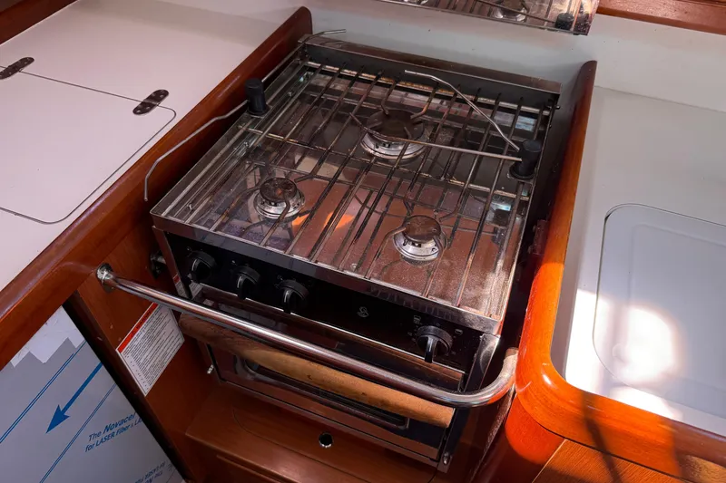 Slide: The Image of Galley stove in 2010 Beneteau Oceanis 43 yacht, featuring a compact design. - 36