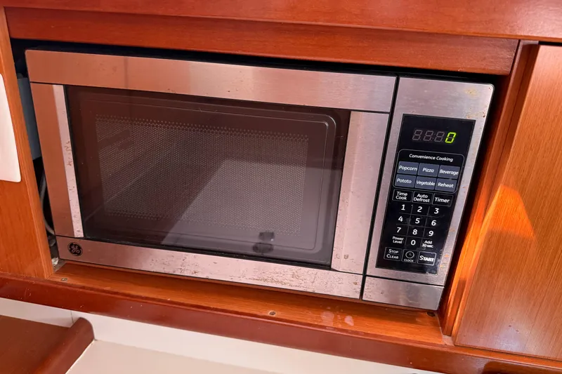 Slide: The Image of Microwave in 2010 Beneteau Oceanis 43 yacht kitchen, stainless steel finish. - 42