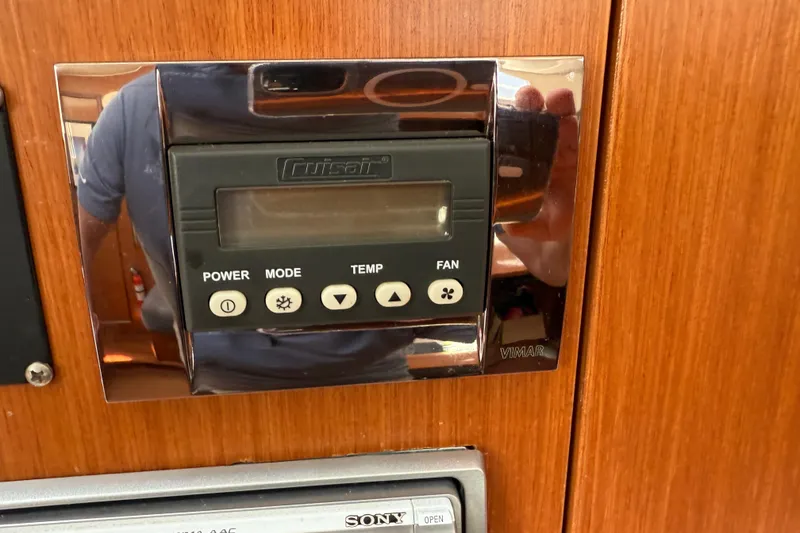 Slide: The Image of Control panel on 2010 Beneteau Oceanis 43 yacht, featuring power, mode, temperature, and fan settings. - 50