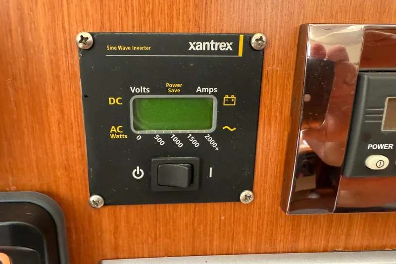 Slide: The Image of Xantrex sine wave inverter on 2010 Beneteau Oceanis 43 yacht, displaying voltage and amperage. - 51