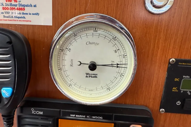 Slide: The Image of Barometer and radio equipment on 2010 Beneteau Oceanis 43 yacht interior panel. - 53
