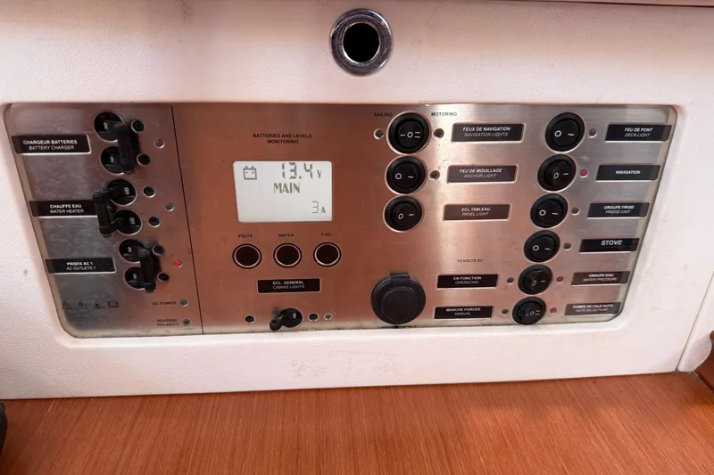 Slide: The Image of Control panel of a 2010 Beneteau Oceanis 43 sailboat, displaying battery and system monitoring. - 54