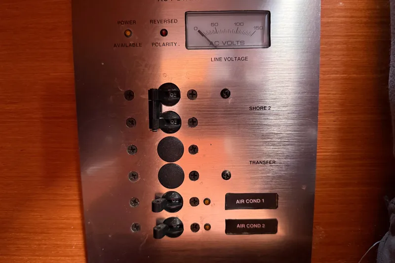 Slide: The Image of Electrical panel on a 2010 Beneteau Oceanis 43 yacht, showing voltage and switches. - 56
