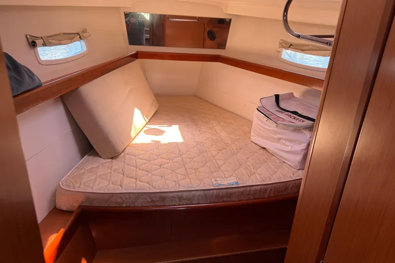Slide: The Image of Cozy cabin interior of 2010 Beneteau Oceanis 43 sailboat with mattress and life jackets. - 57