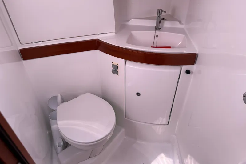 Slide: The Image of Bathroom interior of 2010 Beneteau Oceanis 43 yacht, featuring toilet and sink. - 61