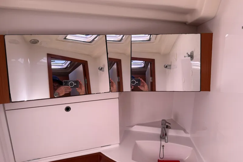 Slide: The Image of Bathroom interior of 2010 Beneteau Oceanis 43 yacht with mirrors and sink. - 62