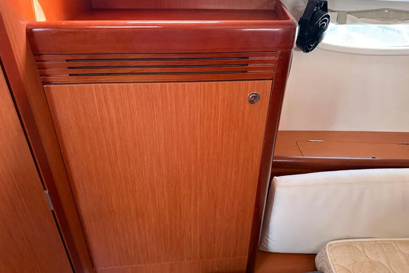Slide: The Image of Interior of 2010 Beneteau Oceanis 43 yacht, featuring wooden cabinetry and seating. - 67