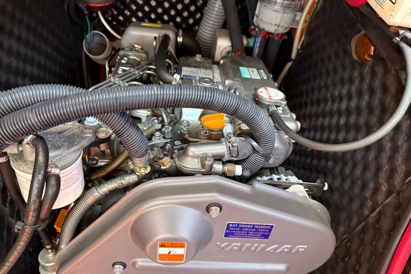 Slide: The Image of Engine compartment of a 2010 Beneteau Oceanis 43 sailboat, featuring a Yanmar engine. - 74