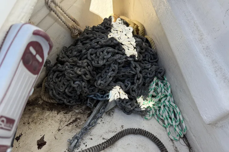 Slide: The Image of Anchor chain and ropes on a 2010 Beneteau Oceanis 43 sailboat deck. - 8