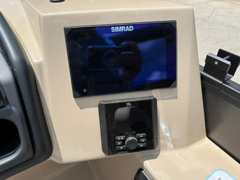 Slide: The Image of Simrad display and JBL control panel on 2026 Bentley Pontoons Legacy 243 Swingback. - 10